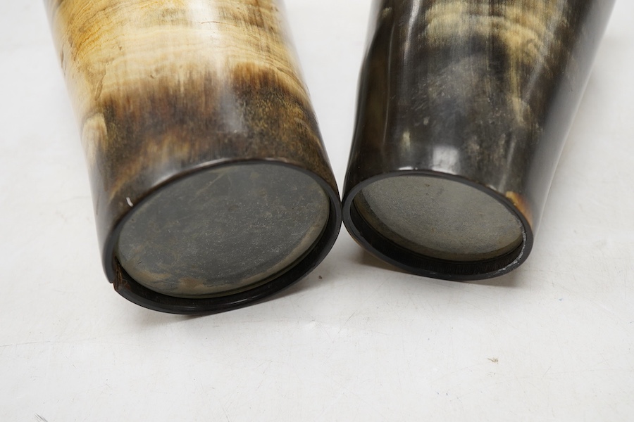 Two Victorian silver mounted horn beakers, by Atkin Brothers, Sheffield, 1882 (split), 14.2cm, and Sheffield, 1884, with shield appliqué, 12.6cm.